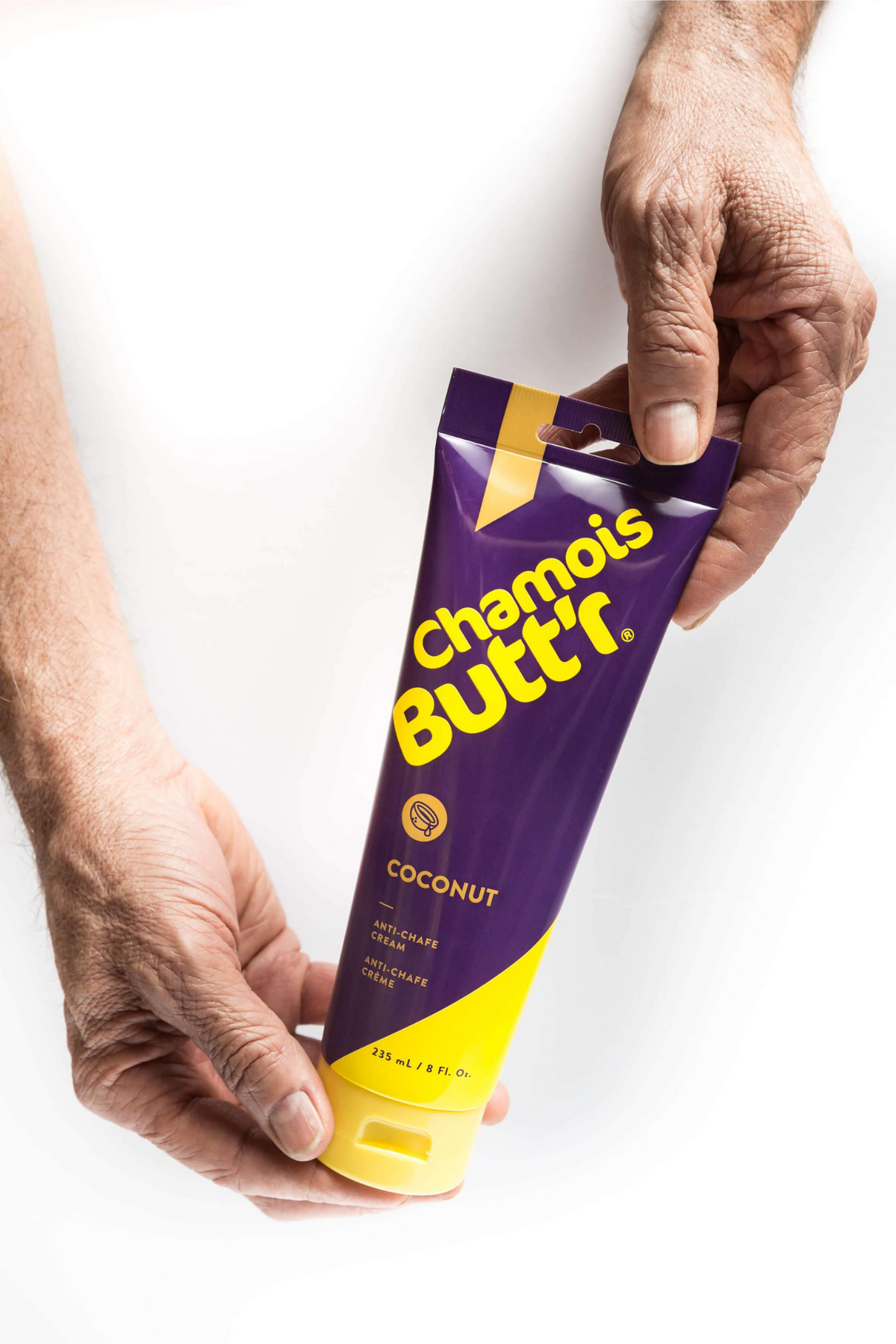 Krem Chamois Butt'r Coconut – tubka w dłoniach | Najs Bike
